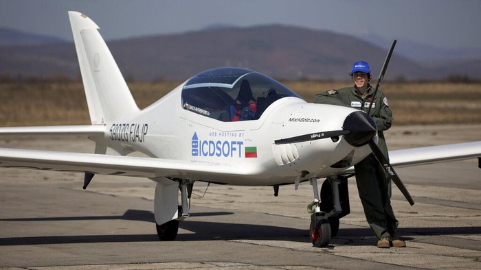 Mack Rutherford, 16 prepares his plane prior to his departure to attempt to fly solo across the world at Sofia-West airport, in Sofia, Wednesday, March 23, 2022. A Belgian-British teenage pilot hopes to join his sister in the record books after starting his attempt to become the youngest person to fly around the world solo in a small plane on Wednesday. (AP Photo/Valentina Petrova)