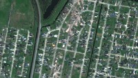 Sebuah citra satelit menunjukkan rumah-rumah yang rusak akibat tornado di lingkungan Arabi di New Orleans, Louisiana, Amerika Serikat, Rabu (23/3/2022) waktu setempat. (Maxar Technologies via REUTERS) 