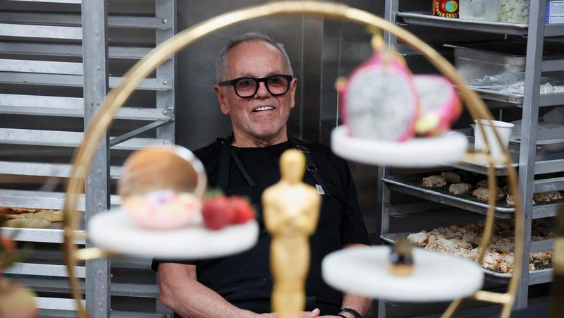 Chef Wolfgang Puck and his team, including the chefs behind the cooking collective 