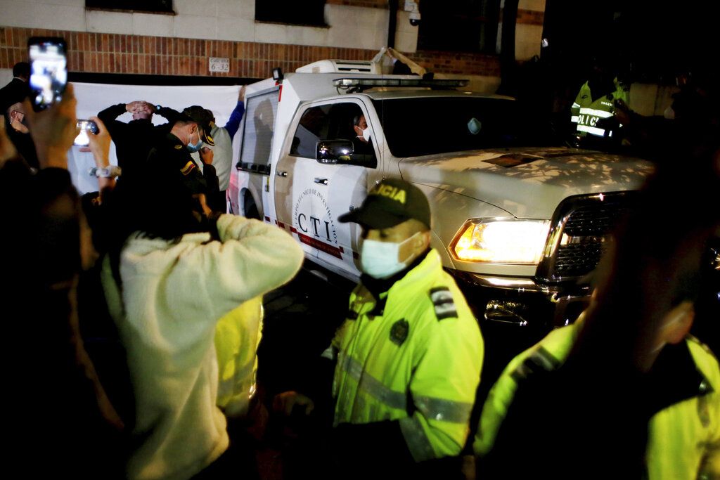 Police stand guard the hotel where drummer Taylor Hawkins was found dead in Bogota, Colombia, Saturday, March 26, 2022. Hawkins, for 25 years the drummer for Foo Fighters and best friend of frontman Dave Grohl, has died during a South American tour with the rock band. He was 50.  (AP Photo/Leonardo Munoz)