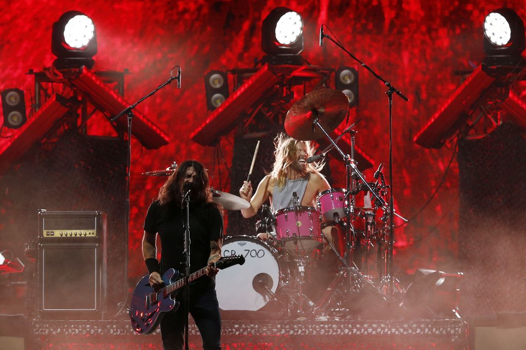 LONDON - JULY 07:  Taylor Hawkins of American rock band Foo Fighters plays with the SOS Allstars on stage during the Live Earth concert held at Wembley Stadium on July 7, 2007 in London. Live Earth is a 24-hour, 7-continent concert series taking place on 7/7/07, bringing together more than 100 music artists and 2 billion people to trigger a global movement to solve the climate crisis.  (Photo by Gareth Cattermole/Getty Images)