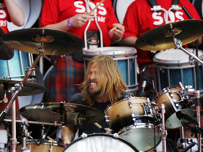LONDON - JULY 07:  Taylor Hawkins of American rock band Foo Fighters plays with the SOS Allstars on stage during the Live Earth concert held at Wembley Stadium on July 7, 2007 in London. Live Earth is a 24-hour, 7-continent concert series taking place on 7/7/07, bringing together more than 100 music artists and 2 billion people to trigger a global movement to solve the climate crisis.  (Photo by Gareth Cattermole/Getty Images)