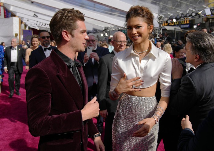 Andrew Garfield, left, and Zendaya arrive at the Oscars on Sunday, March 27, 2022, at the Dolby Theatre in Los Angeles. (AP Photo/John Locher)