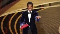 Namun sebuah momen tak terduga terjadi saat Chris Rock menjadi presenter kategori Best Documentary Feature. Chris Pizzello/Invision/AP/Chris Pizzello