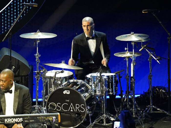 Travis Barker performs at the Oscars on Sunday, March 27, 2022, at the Dolby Theatre in Los Angeles. (AP Photo/Chris Pizzello)