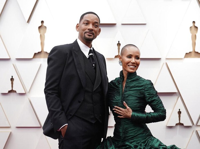 Will Smith, left, and Jada Pinkett Smith arrive at the Oscars on Sunday, March 27, 2022, at the Dolby Theatre in Los Angeles. (AP Photo/Jae C. Hong)