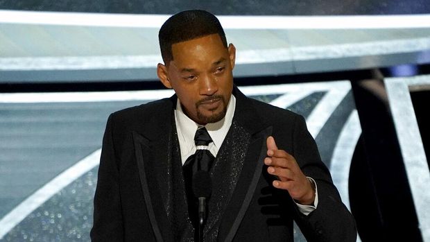Will Smith cries as he accepts the award for best performance by an actor in a leading role for 