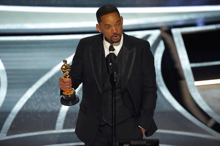 Will Smith cries as he accepts the award for best performance by an actor in a leading role for 
