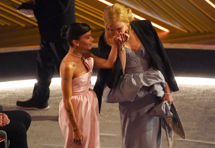 Zoe Kravitz, left, and Nicole Kidman appear in the audience at the Oscars on Sunday, March 27, 2022, at the Dolby Theatre in Los Angeles. (AP Photo/Chris Pizzello)