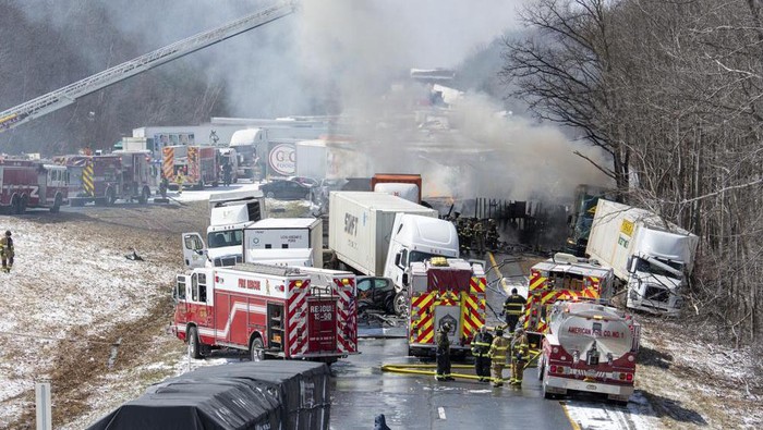Emergency personnel work at the scene of a multi-vehicle crash on Interstate 81 North near the Minersville exit in Foster Township, Pa., Monday, March 28, 2022. (David McKeown/Republican-Herald via AP)
