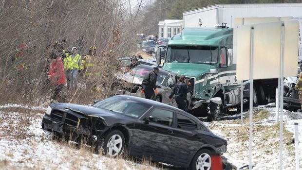 Emergency personnel work at the scene of a multi-vehicle crash on Interstate 81 North near the Minersville exit in Foster Township, Pa., Monday, March 28, 2022. (David McKeown/Republican-Herald via AP)