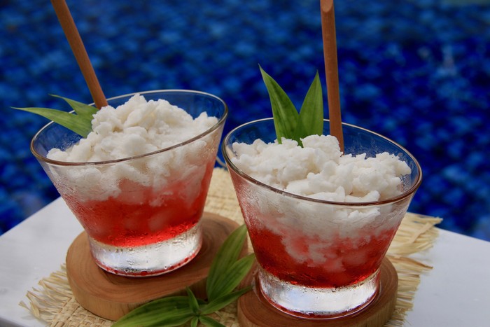 Es Kelapa Kopyor, the Javanese delicacy dessert drink of coconut curds with crushed ice and pandan syrup. This dessert drink is served outdoor at the poolside.
