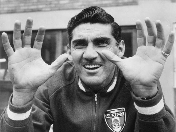 July 1966:  Antonio Carbajal, the Mexican goalkeeper, showing his injured left hand during a training session in Hertfordshire.  (Photo by Hulton Archive/Getty Images)