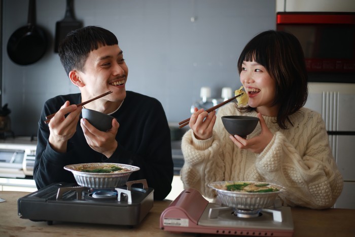 Couple eating a pot