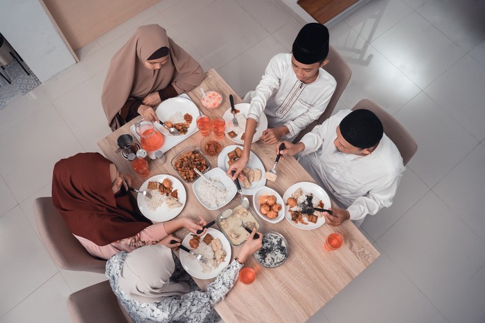 top view muslim family enjoy the iftar meal dinner together in dining room