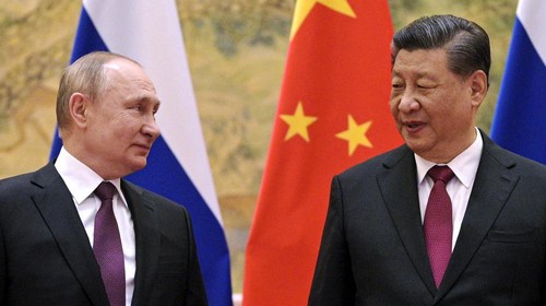 FILE - Chinese President Xi Jinping, right, and Russian President Vladimir Putin talk to each other during their meeting in Beijing, China on Feb. 4, 2022. Three weeks ago, on the eve of the Beijing Winter Olympics, the leaders of China and Russia declared that the friendship between their countries has no limits. But that was before Russias invasion of Ukraine, a gambit that will test just how far China is willing to go. (Alexei Druzhinin, Sputnik, Kremlin Pool Photo via AP, File)