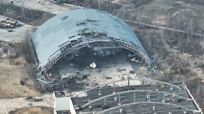 A damaged aircraft is seen in a destroyed hangar at the Antonov International Airport, near Hostomel, Ukraine, March 31, 2022, in this still image obtained from a social media video taken with a drone on March 31, 2022. Babylon'13/via REUTERS THIS IMAGE HAS BEEN SUPPLIED BY A THIRD PARTY. MANDATORY CREDIT.