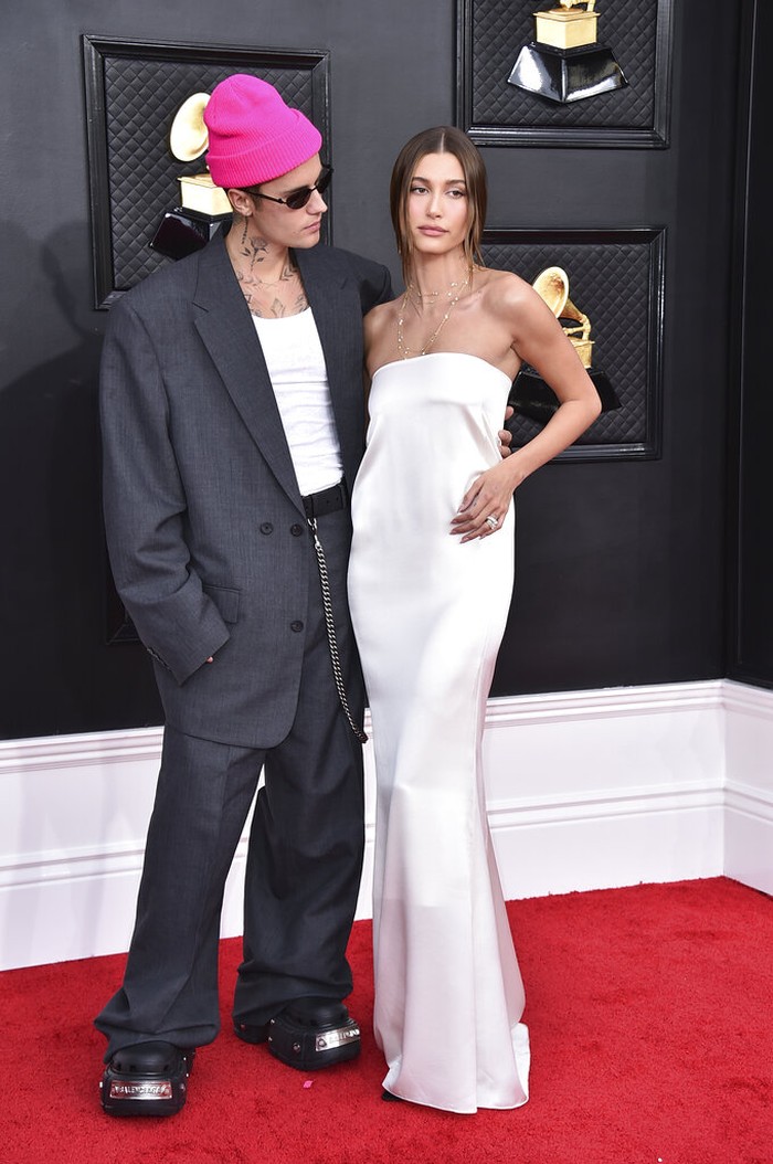 64th Annual Grammy Awards - Arrivals Justin Bieber, left, and Hailey Bieber arrive at the 64th Annual Grammy Awards at the MGM Grand Garden Arena on Sunday, April 3, 2022, in Las Vegas. (Photo by Jordan Strauss/Invision/AP)