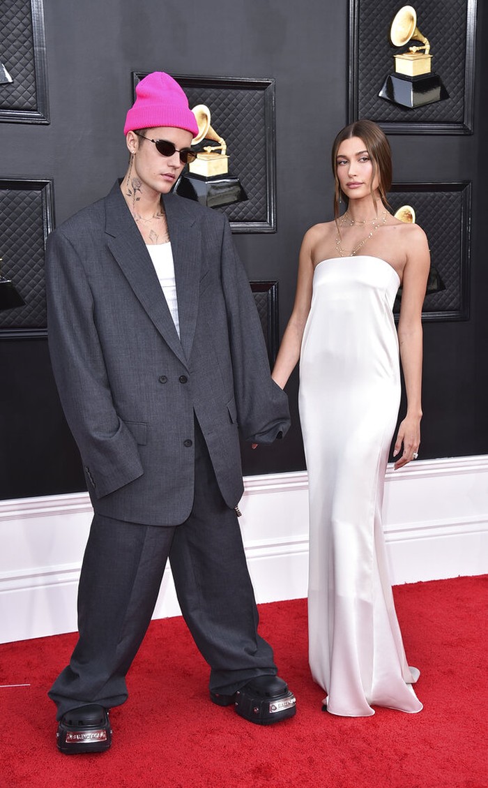 64th Annual Grammy Awards - Arrivals Justin Bieber, left, and Hailey Bieber arrive at the 64th Annual Grammy Awards at the MGM Grand Garden Arena on Sunday, April 3, 2022, in Las Vegas. (Photo by Jordan Strauss/Invision/AP)