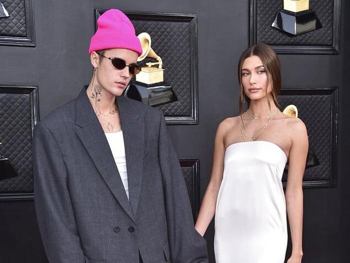 Justin Bieber, left, and Hailey Bieber arrive at the 64th Annual Grammy Awards at the MGM Grand Garden Arena on Sunday, April 3, 2022, in Las Vegas. (Photo by Jordan Strauss/Invision/AP)