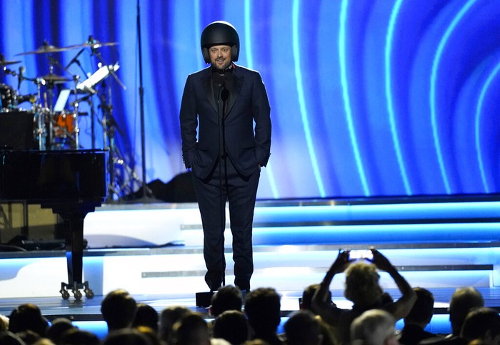 64th Annual Grammy Awards - Show Comedian Nate Bargatze speaks at the 64th Annual Grammy Awards on Sunday, April 3, 2022, in Las Vegas. (AP Photo/Chris Pizzello)