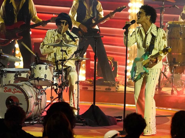 Anderson Paak, left, and Bruno Mars of Silk Sonic perform at the 64th Annual Grammy Awards on Sunday, April 3, 2022, in Las Vegas. (AP Photo/Chris Pizzello)