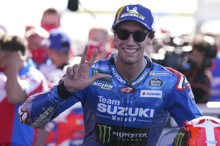 Spans rider Alex Rins of Team SUZUKI ECSTAR celebrates third place on the MotoGP race at the circuit in Termas de Rio Hondo, Argentina, Sunday, April 3, 2022. (AP Photo/Nicolas Aguilera)