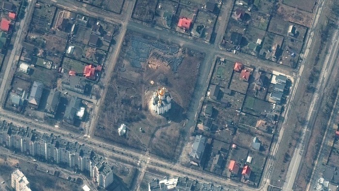 A satellite image shows the grave site with an approximately 45-foot (approximately 13,7 meters) long trench in the southwestern section of the area near the Church of St. Andrew and Pyervozvannoho All Saints, in Bucha, Ukraine, March 31, 2022. Picture taken March 31, 2022. Satellite image 2022 Maxar Technologies/Handout via REUTERS