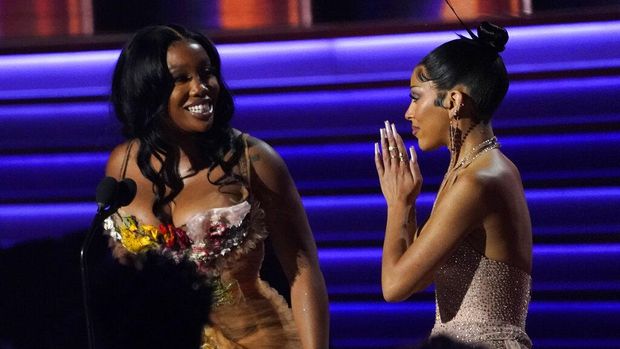 SZA, left, and Doja Cat accept the award for best pop duo/group performance for 