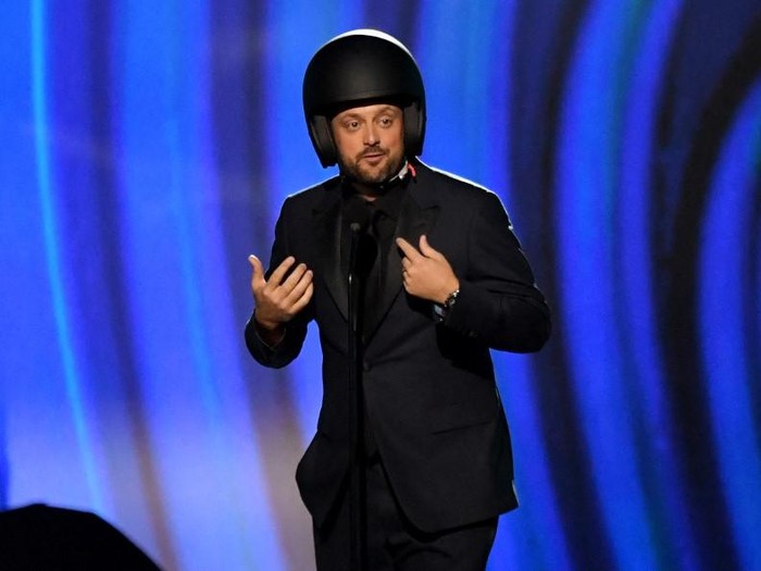 Comedian Nate Bargatze wears a helmet as he arrives to perform onstage during the 64th Annual Grammy Awards pre-telecast show in Las Vegas on April 3, 2022. (Photo by VALERIE MACON / AFP)