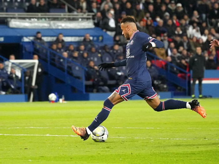 PSG's Neymar scores his side's opening goal during the French League One soccer match between Paris Saint Germain and FC Lorient at Parc des Princes stadium in Paris, Sunday, April 3, 2022. (AP Photo/Michel Euler)