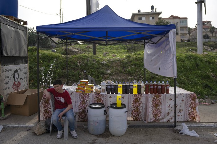 Ramadan Palestinians A Palestinian street vendor bakes Shrak bread, widely desired while breaking fast in Ramadan, in the West Bank city of Ramallah, Saturday, April 2, 2022. The Muslim holy month of Ramadan, when the faithful fast from dawn to dusk, began at sunrise Saturday in much of the Middle East, where Russia's invasion of Ukraine has sent energy and food prices soaring. (AP Photo/Nasser Nasser)