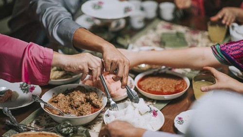 High angle malaysian malay family having family reunion dinner assorted malay food at home celebrating hari raya