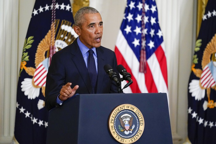 President Joe Biden and former President Barack Obama shake stand together on stage during an event about the Affordable Care Act, in the East Room of the White House in Washington, Tuesday, April 5, 2022. (AP Photo/Carolyn Kaster)