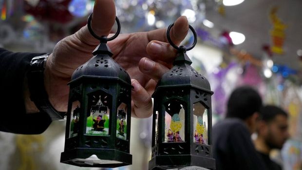 People shop decorations for the Muslim holy month of Ramadan at a shop in Beirut, Lebanon, Saturday, April 2, 2022. Muslims throughout the world are marking the Ramadan, a month of fasting during which observants abstain from food, drink and other pleasures from sunrise to sunset. (AP Photo/Bilal Hussein)