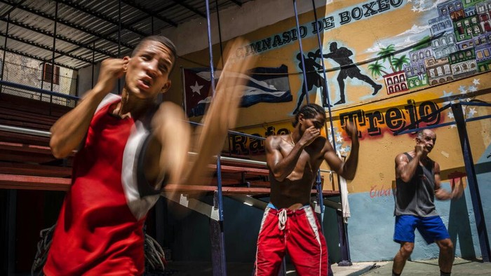 A boxer known as Jonathan trains at the Rafael Trejo boxing gym in Old Havana, Cuba, Wednesday, April 6, 2022. Cuba banned professional boxing shortly after the 1959 revolution, but boxers will be allowed to fight professionally in Cuba again for the first time under a deal with a Mexican promoter, officials announced March 4, 2022. (AP Photo/Ramon Espinosa)