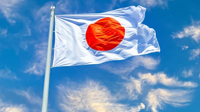 Japanese state flag waving on the wind against the sky