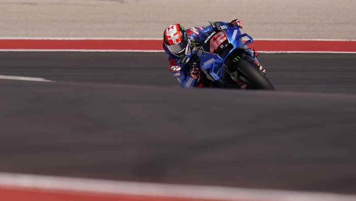 Alex Rins (42), of Spain, steers through a turn during an open practice session for the MotoGP Grand Prix of the Americas motorcycle race at the Circuit of the Americas, Saturday, April 9, 2022, in Austin, Texas. (AP Photo/Eric Gay)