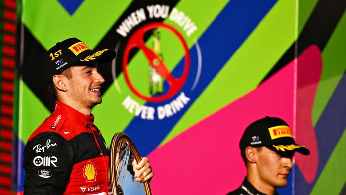 MELBOURNE, AUSTRALIA - APRIL 10: Race winner Charles Leclerc of Monaco and Ferrari celebrates on the podium during the F1 Grand Prix of Australia at Melbourne Grand Prix Circuit on April 10, 2022 in Melbourne, Australia. (Photo by Clive Mason/Getty Images)