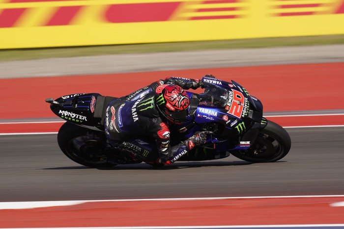 Fabio Quartararo (20), of France, steers through a turn during an open practice session for the MotoGP Grand Prix of the Americas motorcycle race at the Circuit of the Americas, Friday, April 8, 2022, in Austin, Texas. (AP Photo/Eric Gay)
