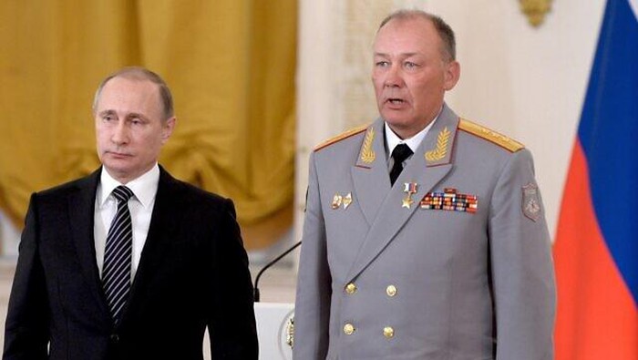 In this pool photo taken on Thursday, March  17, 2016, Russian President Vladimir Putin, left, poses with Col. Gen. Alexander Dvornikov during an awarding ceremony in Moscows Kremlin, Russia . Dvornikov, who commanded the Russian military in Syria, said in an interview released Wednesday that Russias special forces have helped direct air raids in Syria and Russian military advisers have played a key role in the Syrian armys offensive.(Alexei Nikolsky/Sputnik, Kremlin Pool Photo via AP)