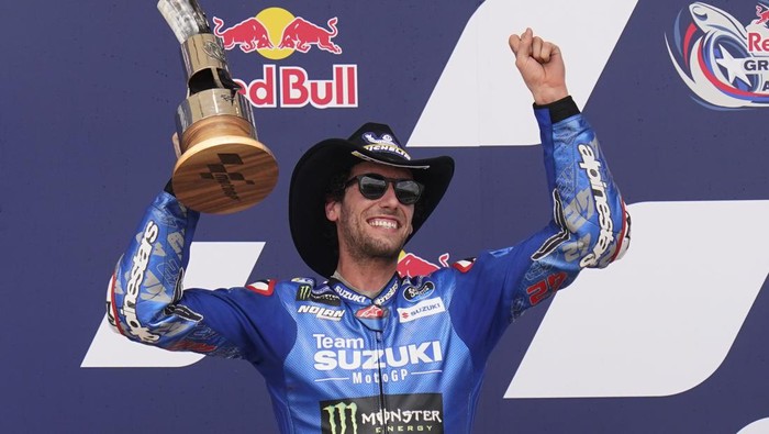 Alex Rins (42), of Spain, celebrates his second place finish in the MotoGP Grand Prix of the Americas motorcycle race at the Circuit of the Americas, Sunday, April 10, 2022, in Austin, Texas. (AP Photo/Eric Gay)
