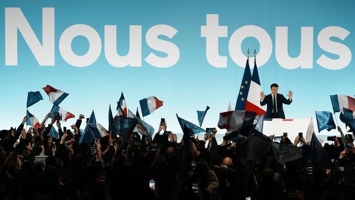 APTOPIX France Presidential Election Current French President and centrist presidential candidate for reelection Emmanuel Macron arrives to delivers his speech at his election night headquarters Sunday, April 10, 2022 in Paris. French polling agencies projected Sunday that incumbent Emmanuel Macron and far-right nationalist Marine Le Pen are heading for another winner-takes-all runoff in the French presidential election, with their fierce political rivalry and sharply opposing visions pulling clear of a crowded field of 12 candidates in the first round of voting. (AP Photo/Thibault Camus)