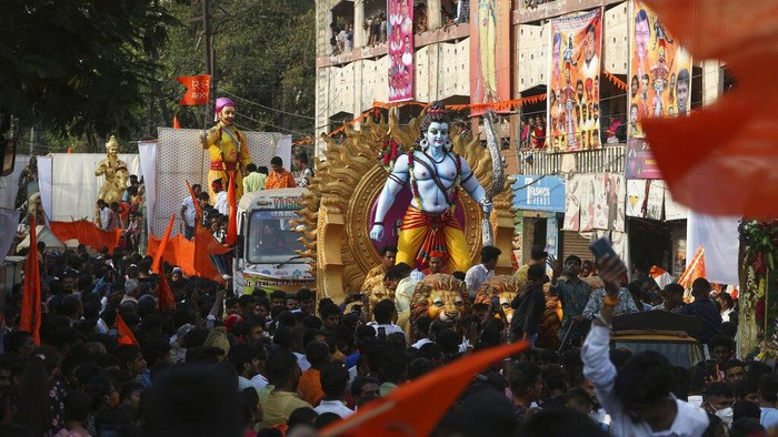 Hindu devotees accompany an idol of Hindu god Rama in a religious procession to celebrate Ram Navami festival in Hyderabad, India, Sunday, April 10, 2022. The festival celebrates the birth anniversary of Rama (AP Photo/Mahesh Kumar A.)