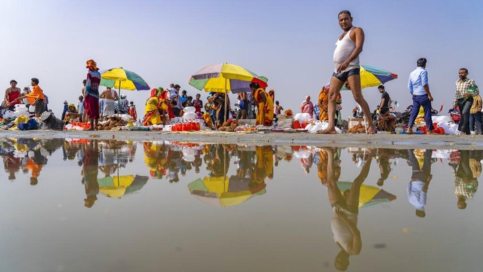 Hindu devotees accompany an idol of Hindu god Rama in a religious procession to celebrate Ram Navami festival in Hyderabad, India, Sunday, April 10, 2022. The festival celebrates the birth anniversary of Rama (AP Photo/Mahesh Kumar A.)