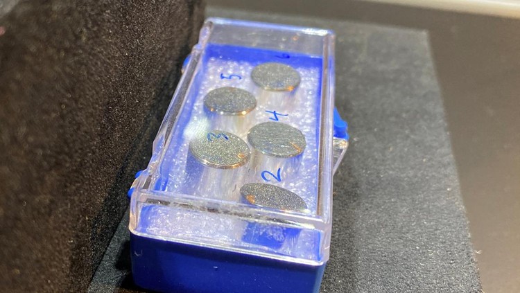 Views of items on display at Bonhams, as a Moon dust sample from the Apollo 11 mission is up for auction, in New York City, U.S., April 11, 2022. REUTERS/Christine Kiernan