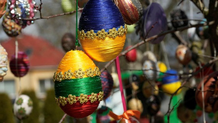 RELIGION-EASTER/LITHUANIA-EGGS Trees decorated with thousands of Easter eggs are seen in the kindergarten in Seduva, Lithuania April 11, 2022. REUTERS/Ints Kalnins
