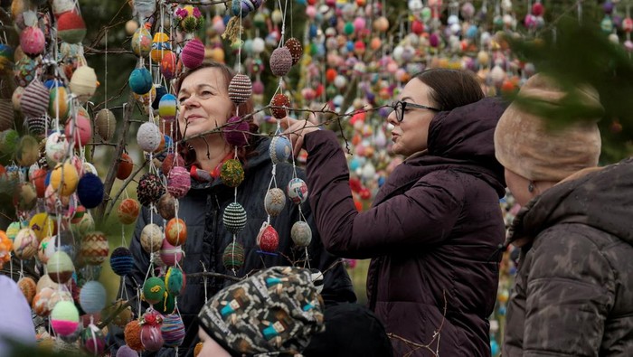 Trees decorated with thousands of Easter eggs are seen in the kindergarten in Seduva, Lithuania April 11, 2022. REUTERS/Ints Kalnins