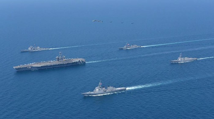 This photo provided by Japan Maritime Self-Defense Force shows USS Abraham Lincoln, left, and JS Kongo, front, sail in formation during a U.S.-Japan bilateral exercise at the Sea of Japan on April 12, 2022. U.S. and Japanese warships, led by the USS Abraham Lincoln carrier strike group, are conducting their joint naval exercise in waters between Japan and the Korean Peninsula for the first time in five yeas, in a show of their close military alliance amid growing speculation of North Koreas missile or nuclear testing later this week.(Japan Maritime Self-Defense Force via AP)