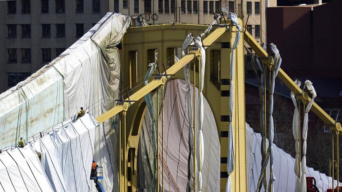 Pennsylvania Daily Life Workers prepare the Roberto Clemente bridge for refurbishing in downtown Pittsburgh on Tuesday, April 12, 2022. The project is expected to be completed by December 2023. (AP Photo/Gene J. Puskar)